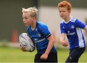 29 July 2021; Marcus McCracken, age 8, in action during the Bank of Ireland Leinster Rugby Summer Camp at Westmanstown RFC in Dublin. Photo by Matt Browne/Sportsfile