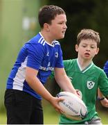 29 July 2021; Harry Hurley, age 8, in action during the Bank of Ireland Leinster Rugby Summer Camp at Westmanstown RFC in Dublin. Photo by Matt Browne/Sportsfile