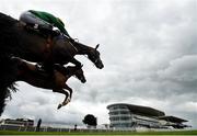 29 July 2021; Farout, with Brian Hayes up, right, clears the last on their first time round alongside Carrarea, with Jack Kennedy up, on their way to winning the Guinness Novice Hurdle on day four of the Galway Races Summer Festival at Ballybrit Racecourse in Galway. Photo by David Fitzgerald/Sportsfile