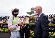 29 July 2021; Jockey Patrick Mullins speaks with his father and trainer Willie Mullins after winning the Guinness Galway Hurdle on Saldier during day four of the Galway Races Summer Festival at Ballybrit Racecourse in Galway. Photo by David Fitzgerald/Sportsfile