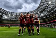 29 July 2021; Rob Cornwall of Bohemians, centre, celebrates with team-mates, from left, Georgie Kelly, Ciarán Kelly and Ross Tierney after scoring his side's first goal during the UEFA Europa Conference League second qualifying round second leg match between Bohemians and F91 Dudelange at Aviva Stadium in Dublin. Photo by Eóin Noonan/Sportsfile