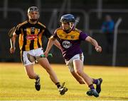 28 July 2021; Cian O Tuama of Wexford in action against Darragh Queally of Kilkenny during the 2021 Electric Ireland Leinster Minor Hurling Championship Final match between Kilkenny and Wexford at Netwatch Cullen Park in Carlow. Photo by Matt Browne/Sportsfile