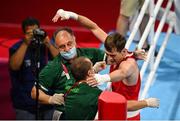 30 July 2021; Aidan Walsh of Ireland celebrates with coaches Zaur Antia, left, and Dmitry Dmitruk after defeating Merven Clair of Mauritius during their men's welterweight quarter-final bout at the Kokugikan Arena during the 2020 Tokyo Summer Olympic Games in Tokyo, Japan. Photo by Stephen McCarthy/Sportsfile