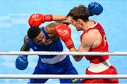30 July 2021; Merven Clair of Mauritius, left, and Aidan Walsh of Ireland during their men's welterweight quarter-final bout at the Kokugikan Arena during the 2020 Tokyo Summer Olympic Games in Tokyo, Japan. Photo by Stephen McCarthy/Sportsfile