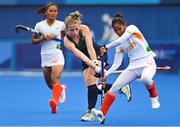 30 July 2021; Hannah Matthews of Ireland in action against Nisha of India during the women's pool A group stage match between Ireland and India at the Oi Hockey Stadium during the 2020 Tokyo Summer Olympic Games in Tokyo, Japan. Photo by Ramsey Cardy/Sportsfile