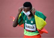 30 July 2021; Selemon Barega of Ethiopia adjusts his facemask after winning the men's 10000 metres final at the Olympic Stadium during the 2020 Tokyo Summer Olympic Games in Tokyo, Japan. Photo by Stephen McCarthy/Sportsfile