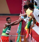 30 July 2021; Selemon Barega of Ethiopia celebrates with members of the Ethiopia delegation after winning the men's 10000 metres final at the Olympic Stadium during the 2020 Tokyo Summer Olympic Games in Tokyo, Japan. Photo by Stephen McCarthy/Sportsfile