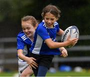 30 July 2021; Ella Vasselin, age 8, and Olivia Linnane, age 9, in action during the Bank of Ireland Leinster Rugby Summer Camp at Navan RFC in Navan, Meath. Photo by Matt Browne/Sportsfile