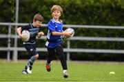 30 July 2021; Jack Macken, age 7, in action during the Bank of Ireland Leinster Rugby Summer Camp at Navan RFC in Navan, Meath. Photo by Matt Browne/Sportsfile