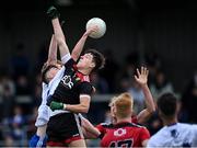 30 July 2021; Darragh McElearney of Monaghan, centre, palms the ball past Down goalkeeper Charlie Smyth for his side's first goal during the EirGrid Ulster GAA Football U20 Championship Final match between Down and Monaghan at Athletic Grounds in Armagh. Photo by Piaras Ó Mídheach/Sportsfile