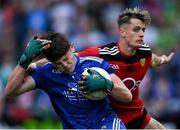 30 July 2021; Monaghan goalkeeper Ryan Farrelly is tackled by John McGovern of Down during the EirGrid Ulster GAA Football U20 Championship Final match between Down and Monaghan at Athletic Grounds in Armagh. Photo by Piaras Ó Mídheach/Sportsfile