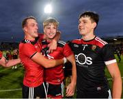 30 July 2021; Down players Tom Close, Eamon Brown, and Charlie Smyth celebrate after their side's victory in the EirGrid Ulster GAA Football U20 Championship Final match between Down and Monaghan at Athletic Grounds in Armagh. Photo by Piaras Ó Mídheach/Sportsfile