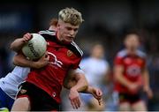 30 July 2021; Patrick McCarthy of Down in action against Ronan Grimes of Monaghan during the EirGrid Ulster GAA Football U20 Championship Final match between Down and Monaghan at Athletic Grounds in Armagh. Photo by Piaras Ó Mídheach/Sportsfile