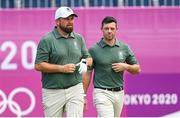 31 July 2021; Shane Lowry, left, and Rory McIlroy of Ireland walk away from the first tee box after teeing off during round 3 of the men's individual stroke play at the Kasumigaseki Country Club during the 2020 Tokyo Summer Olympic Games in Kawagoe, Saitama, Japan. Photo by Ramsey Cardy/Sportsfile
