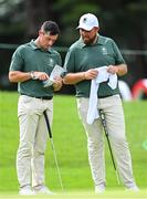 31 July 2021; Rory McIlroy, left, and Shane Lowry of Ireland on the 16th green during round 3 of the men's individual stroke play at the Kasumigaseki Country Club during the 2020 Tokyo Summer Olympic Games in Kawagoe, Saitama, Japan. Photo by Ramsey Cardy/Sportsfile
