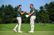31 July 2021; Rory McIlroy, left, and Shane Lowry of Ireland exchange a handshake on the 18th green after completing round 3 of the men's individual stroke play at the Kasumigaseki Country Club during the 2020 Tokyo Summer Olympic Games in Kawagoe, Saitama, Japan. Photo by Ramsey Cardy/Sportsfile