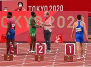 31 July 2021; Divine Oduduru of Nigeria speaks to the starter after being disqualified for a false start in action during round one of the men's 100 metres at the Olympic Stadium during the 2020 Tokyo Summer Olympic Games in Tokyo, Japan. Photo by Brendan Moran/Sportsfile