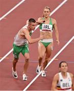 31 July 2021; Christopher O'Donnell of Ireland takes the baton from team-mate Sophie Becker during the mixed 4 x 400 metres relay final at the Olympic Stadium during the 2020 Tokyo Summer Olympic Games in Tokyo, Japan. Photo by Brendan Moran/Sportsfile