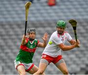 31 July 2021; Chris Kearns of Tyrone clears under pressure from Keith Higgins of Mayo during the Nicky Rackard Cup Final match between Tyrone and Mayo at Croke Park in Dublin.  Photo by Ray McManus/Sportsfile