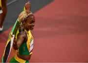 31 July 2021; Elaine Thompson-Herah of Jamaica celebrates after winning the women's 100 metres final in a new olympic record time on day eight of the Olympic Stadium during the 2020 Tokyo Summer Olympic Games in Tokyo, Japan. Photo by Brendan Moran/Sportsfile