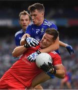 31 July 2021; Kieran McGeary of Tyrone is tackled by Aaron Mulligan of Monaghan during the Ulster GAA Football Senior Championship Final match between Monaghan and Tyrone at Croke Park in Dublin. Photo by Ray McManus/Sportsfile