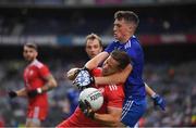 31 July 2021; Kieran McGeary of Tyrone is tackled by Aaron Mulligan of Monaghan during the Ulster GAA Football Senior Championship Final match between Monaghan and Tyrone at Croke Park in Dublin. Photo by Ray McManus/Sportsfile