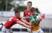 31 July 2021; Rory Egan of Offaly in action against Colm Walsh and Michael O'Neill of Cork during the 2021 EirGrid GAA All-Ireland Football U20 Championship Semi-Final match between Cork and Offaly at MW Hire O'Moore Park in Portlaoise, Laois. Photo by Matt Browne/Sportsfile