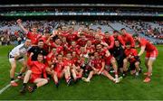 31 July 2021; The Tyrone players and officials celebrate with the Anglo Celt Cup after the Ulster GAA Football Senior Championship Final match between Monaghan and Tyrone at Croke Park in Dublin. Photo by Ray McManus/Sportsfile