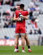 31 July 2021; Pádraig Hampsey of Tyrone, right, and Tyrone goalkeeper Niall Morgan embrace after the Ulster GAA Football Senior Championship Final match between Monaghan and Tyrone at Croke Park in Dublin. Photo by Harry Murphy/Sportsfile