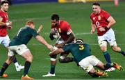 31 July 2021; Courtney Lawes of British and Irish Lions is tackled Frans Malherbe, right, and Steven Kitshoff by during the second test of the British and Irish Lions tour match between South Africa and British and Irish Lions at Cape Town Stadium in Cape Town, South Africa. Photo by Ashley Vlotman/Sportsfile