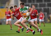 31 July 2021; Cathal Donoghue of Offaly in action against Darragh Holland of Cork during the 2021 EirGrid GAA All-Ireland Football U20 Championship Semi-Final match between Cork and Offaly at MW Hire O'Moore Park in Portlaoise, Laois. Photo by Matt Browne/Sportsfile