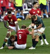 31 July 2021; Alun Wyn Jones of British and Irish Lions, supporterd by Courtney Lawess, is tackled by Steven Kitshoff, left, and Kwagga Smith of South Africa during the second test of the British and Irish Lions tour match between South Africa and British and Irish Lions at Cape Town Stadium in Cape Town, South Africa. Photo by Ashley Vlotman/Sportsfile