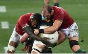 31 July 2021; Courtney Lawes, left, and Alun Wyn Jones of British and Irish Lions tackle Franco Mostert of South Africa during the second test of the British and Irish Lions tour match between South Africa and British and Irish Lions at Cape Town Stadium in Cape Town, South Africa. Photo by Ashley Vlotman/Sportsfile