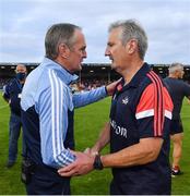 31 July 2021; Dublin manager Mattie Kenny, left, and Cork manager Kieran Kingston shake hands after the GAA Hurling All-Ireland Senior Championship Quarter-Final match between Dublin and Cork at Semple Stadium in Thurles, Tipperary. Photo by Piaras Ó Mídheach/Sportsfile