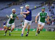 31 July 2021; Caoimhín Carney of Cavan is tackled by Dan Teague, left, and Rory Porteous of Fermanagh during the Lory Meagher Cup Final match between Fermanagh and Cavan at Croke Park in Dublin.  Photo by Ray McManus/Sportsfile