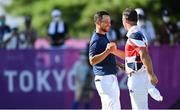 1 August 2021; Xander Schauffele of USA, left, and Paul Casey of Great Britain exchange a handshake on the 18th green during round 4 of the men's individual stroke play at the Kasumigaseki Country Club during the 2020 Tokyo Summer Olympic Games in Kawagoe, Saitama, Japan. Photo by Ramsey Cardy/Sportsfile