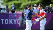 1 August 2021; Xander Schauffele of USA, left, and Paul Casey of Great Britain exchange a handshake on the 18th green during round 4 of the men's individual stroke play at the Kasumigaseki Country Club during the 2020 Tokyo Summer Olympic Games in Kawagoe, Saitama, Japan. Photo by Ramsey Cardy/Sportsfile