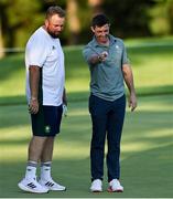 1 August 2021; Rory McIlroy of Ireland looks back on his missed putt on the 11th with Shane Lowry of Ireland during the bronze medal play-off in round 4 of the men's individual stroke play at the Kasumigaseki Country Club during the 2020 Tokyo Summer Olympic Games in Kawagoe, Saitama, Japan. Photo by Ramsey Cardy/Sportsfile