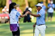 1 August 2021; CT Pan of Chinese Taipei fist bumps his wife and caddie Yingchun Lin after a birdie on the 11th during the bronze medal play-off in round 4 of the men's individual stroke play at the Kasumigaseki Country Club during the 2020 Tokyo Summer Olympic Games in Kawagoe, Saitama, Japan. Photo by Ramsey Cardy/Sportsfile