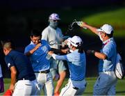 1 August 2021; CT Pan of Chinese Taipei celebrates with team-mates after winning the bronze medal play-off in round 4 of the men's individual stroke play at the Kasumigaseki Country Club during the 2020 Tokyo Summer Olympic Games in Kawagoe, Saitama, Japan. Photo by Ramsey Cardy/Sportsfile