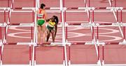 1 August 2021; Luca Kozak of Hungary helps up Yanique Thompson of Jamaica after they both fell in the Women's 100 metre hurdles semi-finals at the Olympic Stadium on day nine of the 2020 Tokyo Summer Olympic Games in Tokyo, Japan. Photo by Brendan Moran/Sportsfile
