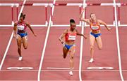 1 August 2021; Jasmine Camacho-Quinn of Puerto Rico, centre, crosses the line to win her Women's 100 metre hurdles semi-finals in Olympic record time at the Olympic Stadium on day nine of the 2020 Tokyo Summer Olympic Games in Tokyo, Japan. Photo by Brendan Moran/Sportsfile