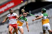 1 August 2021; Deaghlan Foley of Derry in action against Aidan Treacy, centre, and David King of Offaly during the Christy Ring Cup Final match between Derry and Offaly at Croke Park in Dublin.  Photo by Piaras Ó Mídheach/Sportsfile