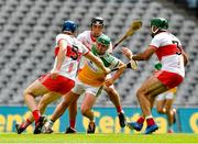 1 August 2021; Eoghan Cahill of Offaly in action against Brian McGilligan, 5, Meehaul McGrath and full back Seán Cassidy of Derry during the Christy Ring Cup Final match between Derry and Offaly at Croke Park in Dublin. Photo by Ray McManus/Sportsfile