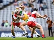 1 August 2021; Paddy Delaney of Offaly in action against Brian Cassidy, left, and Sé McGuigan of Derry during the Christy Ring Cup Final match between Derry and Offaly at Croke Park in Dublin. Photo by Piaras Ó Mídheach/Sportsfile