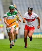 1 August 2021; Eoghan Cahill of Offaly in action against Meehaul McGrath of Derry during the Christy Ring Cup Final match between Derry and Offaly at Croke Park in Dublin. Photo by Ray McManus/Sportsfile