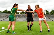 1 August 2021; Team captains Shauna Ennis of Meath, left, and Kelly Mallon of Armagh, right, bump fists in front of referee Brendan Rice before the TG4 Ladies Football All-Ireland Championship Quarter-Final match between Armagh and Meath at St Tiernach's Park in Clones, Monaghan. Photo by Sam Barnes/Sportsfile