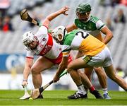 1 August 2021; Odhran McKeever of Derry in action against Paddy Delaney, 2, and Ciarán Burke of Offaly during the Christy Ring Cup Final match between Derry and Offaly at Croke Park in Dublin. Photo by Piaras Ó Mídheach/Sportsfile