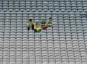 1 August 2021; Offaly supporters, left to right, Seán Hassett, Ronan McNamara, Gearóid McCormack and Cian Burke relax in the Cusack stand as they watch the Christy Ring Cup Final match between Derry and Offaly at Croke Park in Dublin. Photo by Ray McManus/Sportsfile