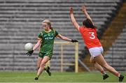 1 August 2021; Stacey Grimes of Meath kicks a score under pressure from Clodagh McCambridge of Armagh during the TG4 Ladies Football All-Ireland Championship Quarter-Final match between Armagh and Meath at St Tiernach's Park in Clones, Monaghan. Photo by Sam Barnes/Sportsfile